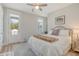 Comfortable bedroom with ceiling fan, balcony door, and natural light from a window at 2383 Lenwick Hall Ln, Johns Island, SC 29455