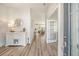 Bright foyer with wood floors, decorative console table, and views into the home's open layout at 2383 Lenwick Hall Ln, Johns Island, SC 29455