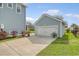 Detached garage with ample parking space and well-maintained landscaping at 2383 Lenwick Hall Ln, Johns Island, SC 29455