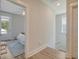 Upstairs hallway with a view of a bedroom and a door leading to a possible balcony at 2383 Lenwick Hall Ln, Johns Island, SC 29455