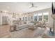 Spacious living room with sofa, area rug, and view to the kitchen at 2383 Lenwick Hall Ln, Johns Island, SC 29455