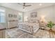 Relaxing main bedroom with stylish decor, soft lighting, and decorative area rug at 2383 Lenwick Hall Ln, Johns Island, SC 29455