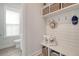Mudroom with bench, storage baskets and hooks at 2383 Lenwick Hall Ln, Johns Island, SC 29455