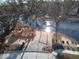 Aerial view of a community playground with custom wooden structures and swings situated on a waterfront at 2383 Lenwick Hall Ln, Johns Island, SC 29455