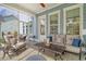 Inviting screened porch with comfortable furniture and views of the backyard at 2383 Lenwick Hall Ln, Johns Island, SC 29455
