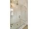 Glass enclosed shower featuring dual shower heads and a built in bench at 2383 Lenwick Hall Ln, Johns Island, SC 29455