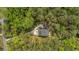 Aerial view of a private home with mature trees, a long driveway, and a manicured lawn at 2856 Claybrook St, Johns Island, SC 29455