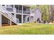Backyard with bar, fire pit, outdoor seating, and stairs leading to a deck at 2856 Claybrook St, Johns Island, SC 29455