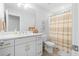 Clean bathroom featuring white cabinetry, a long vanity with double sinks, and a separate toilet and shower at 2856 Claybrook St, Johns Island, SC 29455