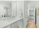 Clean bathroom with a white vanity, mirror, and ample lighting, creating a bright and functional space at 2856 Claybrook St, Johns Island, SC 29455