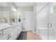 Well-lit bathroom featuring a double sink vanity and a separate tiled shower at 2856 Claybrook St, Johns Island, SC 29455