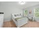 Bright bedroom with a comfortable bed, desk, and natural light, creating a serene and inviting space at 2856 Claybrook St, Johns Island, SC 29455