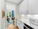 Butler's pantry features white cabinets, quartz countertops, and stainless steel appliances at 2856 Claybrook St, Johns Island, SC 29455