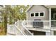 Deck with grilling area, seating, and a view of the surrounding trees at 2856 Claybrook St, Johns Island, SC 29455