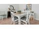 Bright dining area with white table, chairs, and stylish decor, perfect for Gathering meals and entertaining at 2856 Claybrook St, Johns Island, SC 29455