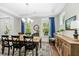 Charming dining area with seating for eight, recessed lighting, tray ceiling, and a warm, inviting atmosphere at 2856 Claybrook St, Johns Island, SC 29455