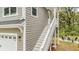 Home exterior featuring the stairs to the side entrance of the home and outdoor patio furniture at 2856 Claybrook St, Johns Island, SC 29455