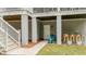 View of lower-level covered outdoor space, bar, and stairs to a deck above at 2856 Claybrook St, Johns Island, SC 29455