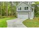 Charming two-story home with a gray exterior, white garage door, and lush green lawn at 2856 Claybrook St, Johns Island, SC 29455