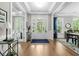 Grand foyer with hardwood floors, elegant lighting, and backyard view at 2856 Claybrook St, Johns Island, SC 29455