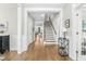 Welcoming foyer with hardwood floors, staircase, and elegant trim at 2856 Claybrook St, Johns Island, SC 29455