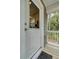 Inviting front door with window and covered porch, blending indoor comfort with outdoor scenery at 2856 Claybrook St, Johns Island, SC 29455