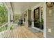 Spacious front porch with rocking chairs and decorative plants at 2856 Claybrook St, Johns Island, SC 29455