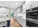 Modern kitchen features stainless steel appliances, quartz countertops, and white subway tile backsplash at 2856 Claybrook St, Johns Island, SC 29455