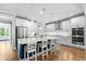 Bright kitchen with stainless steel appliances, a large quartz island, and a breakfast bar at 2856 Claybrook St, Johns Island, SC 29455
