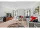 Spacious living room with plush seating, a large TV, and stylish decor, creating a cozy and inviting atmosphere at 2856 Claybrook St, Johns Island, SC 29455
