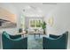 Bright living room featuring stylish decor, comfortable seating, and a view of lush greenery at 2856 Claybrook St, Johns Island, SC 29455