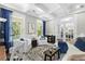 Comfortable living area with stylish decor, coffered ceiling, neutral walls, and a seamless transition to the outdoors at 2856 Claybrook St, Johns Island, SC 29455