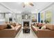 Bright living room with a fireplace, two sofas, and views to the Kitchen at 2856 Claybrook St, Johns Island, SC 29455