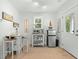 Compact mini kitchen with essential appliances and a charming breakfast nook by the window at 2856 Claybrook St, Johns Island, SC 29455