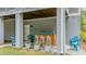 Stylish outdoor bar under covered patio, complete with bar stools and decorative plants at 2856 Claybrook St, Johns Island, SC 29455