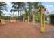 Charming community playground with swings, a boat play structure, and picnic tables for Gathering fun at 2856 Claybrook St, Johns Island, SC 29455