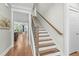 Elegant staircase with wood and white accents, leading to the upper level at 2856 Claybrook St, Johns Island, SC 29455