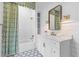 Bright bathroom featuring a shower, vanity, and patterned tile floors at 301 Hidden Bottom Ln, Daniel Island, SC 29492