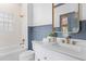 Bright bathroom featuring a shower, vanity, and white marble counter at 301 Hidden Bottom Ln, Daniel Island, SC 29492