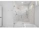 Modern bathroom featuring a frameless glass shower with marble tile and a handheld shower head at 301 Hidden Bottom Ln, Daniel Island, SC 29492