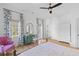 Spacious primary bedroom with wood floors, walk out balcony, and ample sunlight at 301 Hidden Bottom Ln, Daniel Island, SC 29492