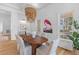 Elegant dining room featuring natural light, modern furnishings, and stylish decor at 301 Hidden Bottom Ln, Daniel Island, SC 29492