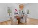Bright dining room showcasing a decorative light fixture and ample natural light at 301 Hidden Bottom Ln, Daniel Island, SC 29492