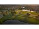 Picturesque golf course with lush fairways and a tranquil pond for recreational enjoyment at 301 Hidden Bottom Ln, Daniel Island, SC 29492