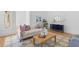 Cozy living room featuring a comfortable sofa, stylish coffee table, and elegant decor accents at 301 Hidden Bottom Ln, Daniel Island, SC 29492