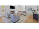 Cozy living room featuring a fireplace, hardwood floors, and comfortable seating at 301 Hidden Bottom Ln, Daniel Island, SC 29492
