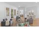 Open-concept living room with access to the breakfast nook and wet bar at 301 Hidden Bottom Ln, Daniel Island, SC 29492