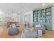 Spacious living room flows into an open kitchen, creating an inviting area for Gathering and guests at 301 Hidden Bottom Ln, Daniel Island, SC 29492