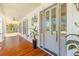 Inviting front porch featuring hardwood flooring and elegant architectural details at 301 Hidden Bottom Ln, Daniel Island, SC 29492