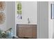 Convenient wet bar showcases custom cabinets and marble counters at 301 Hidden Bottom Ln, Daniel Island, SC 29492